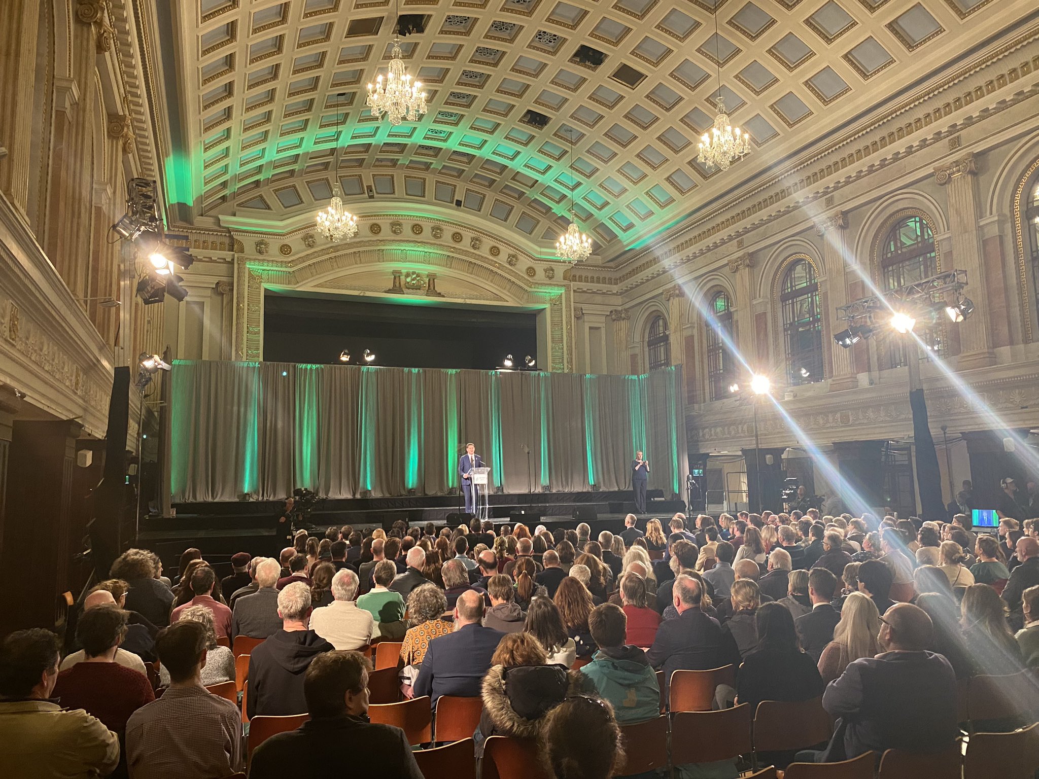 Green Party National Convention 2023 Leader's Speech, with Deputy Eamon Ryan on the stage, lit by green light