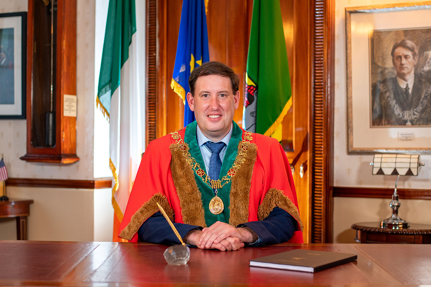 Lord Mayor sitting at desk