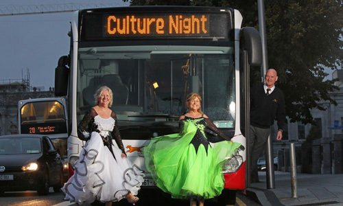 Dancers outside Culture Night Bus with conductor