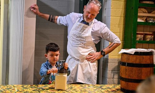 Child making butter at the Butter Museum as part of Cork on a Fork Festival