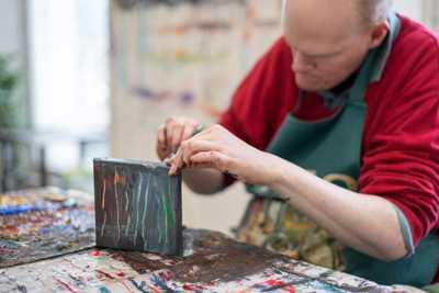Artist working in studio at Crawford Supported Studios