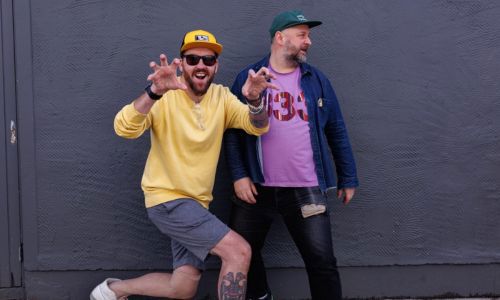Two men in hats on the street