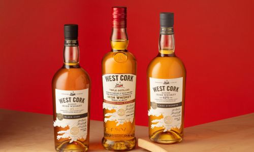 Three bottles of West Cork Whiskey on a counter-top