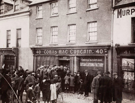 People gather outside the house of Tomas MacCurtain 1920. L1963.100-D2.1-Photo-Thomas-MacCurtain-Funeral-Volunteers-60-x-60-cm