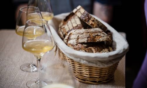 Basket of Sourdough and Glasses of Wine