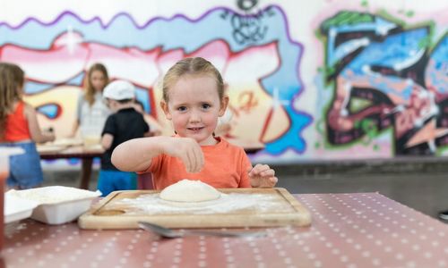 Oakfire Pizza Making Demo Young Girl making  pizza base