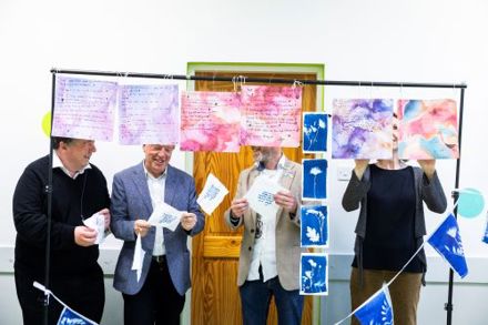 Dominic Campbell, Councillor Tony Fitzgerald, Councillor Oliver Moran and Louise Tangney examining art work at the Roam exhibition in Knocknaheeny Youth Project