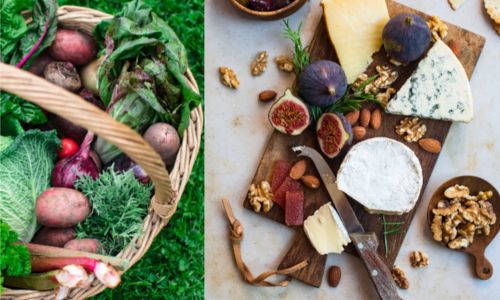 Array of cheese and passion fruit on a board with a cheese knife and basket of vegetables