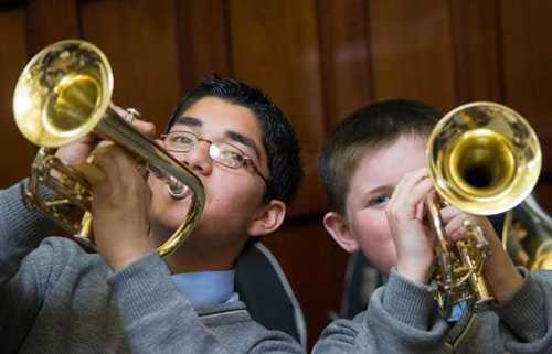 Two young musician playing trumpets