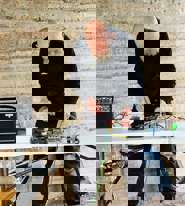 Mick O'Dea makes sound art with electronic equipment in the EcoLab